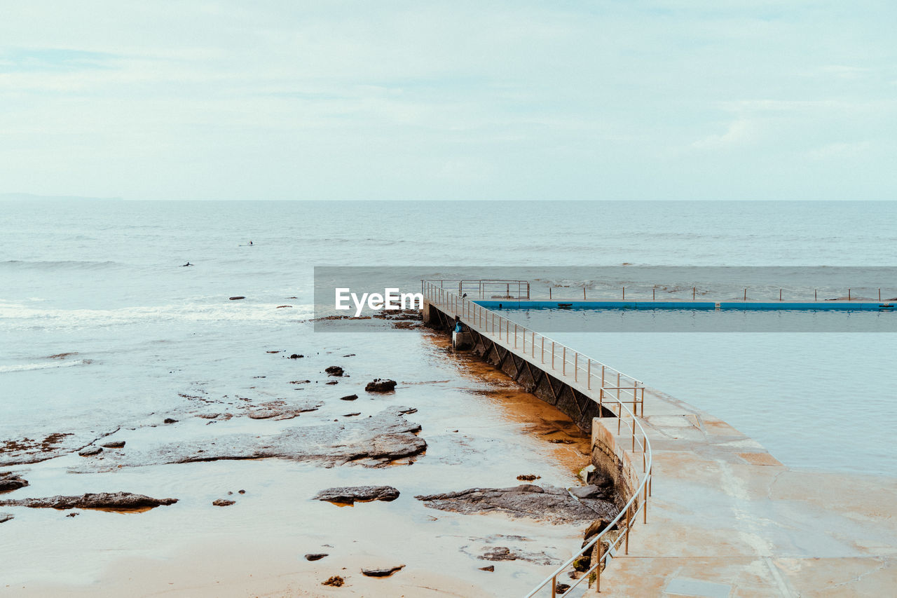 Scenic view of a swimming pool and sea against sky