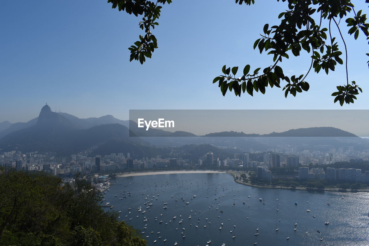 View of buildings in city against clear sky