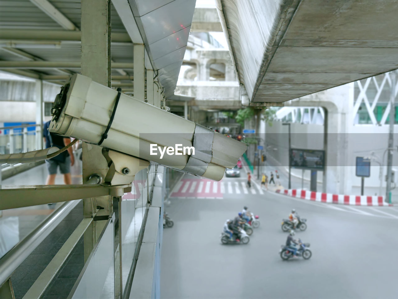 Close-up surveillance camera recording traffic in the city