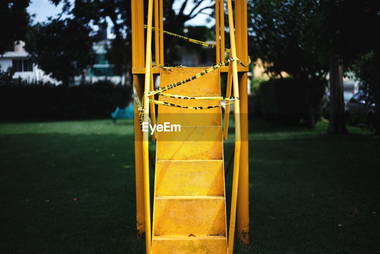 View of yellow slide in playground
