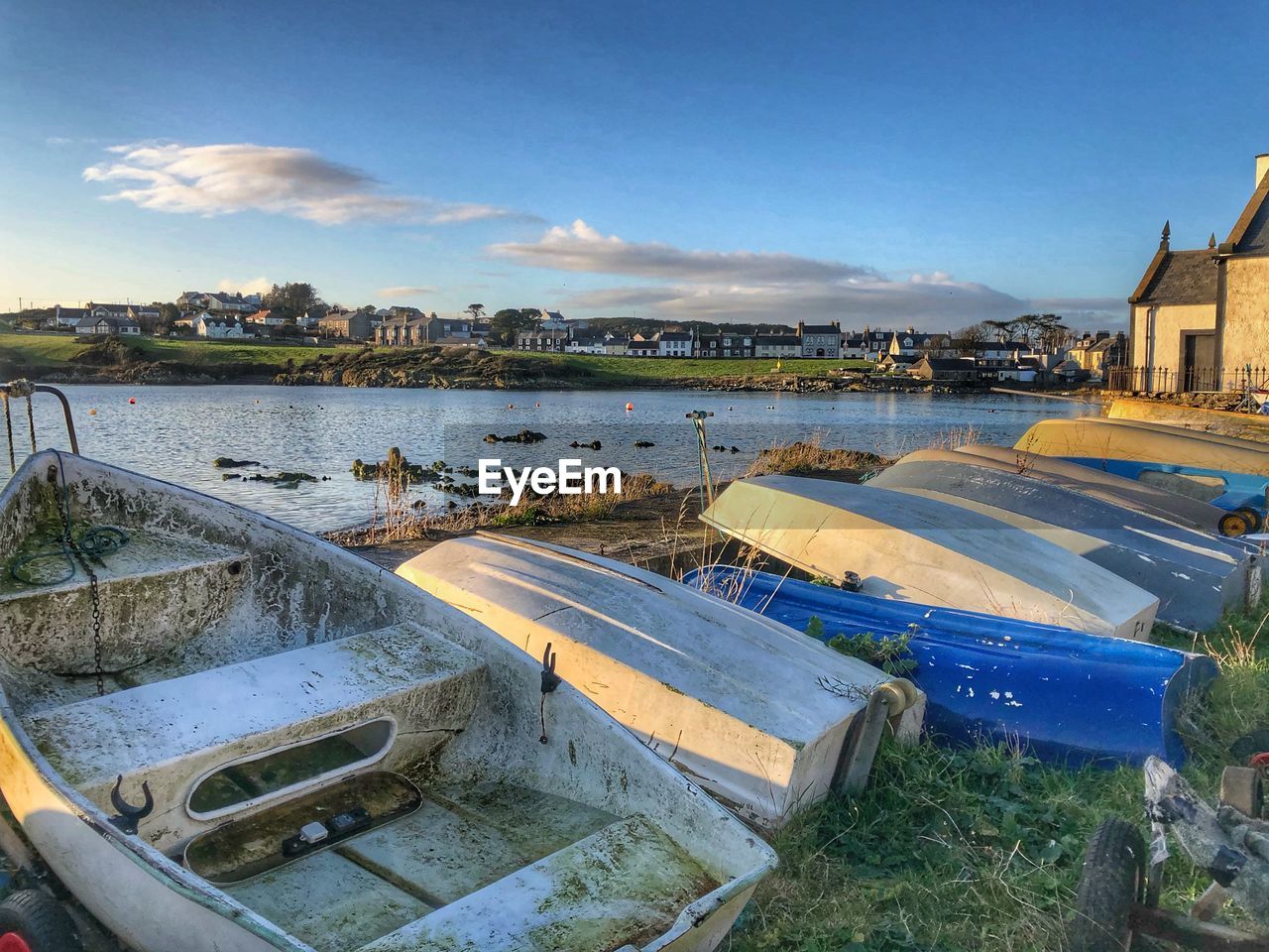 High angle view of river by buildings against sky