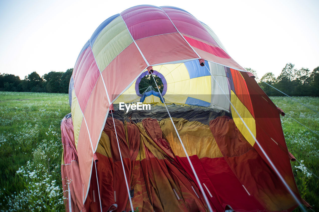 MULTI COLORED TENT IN FIELD