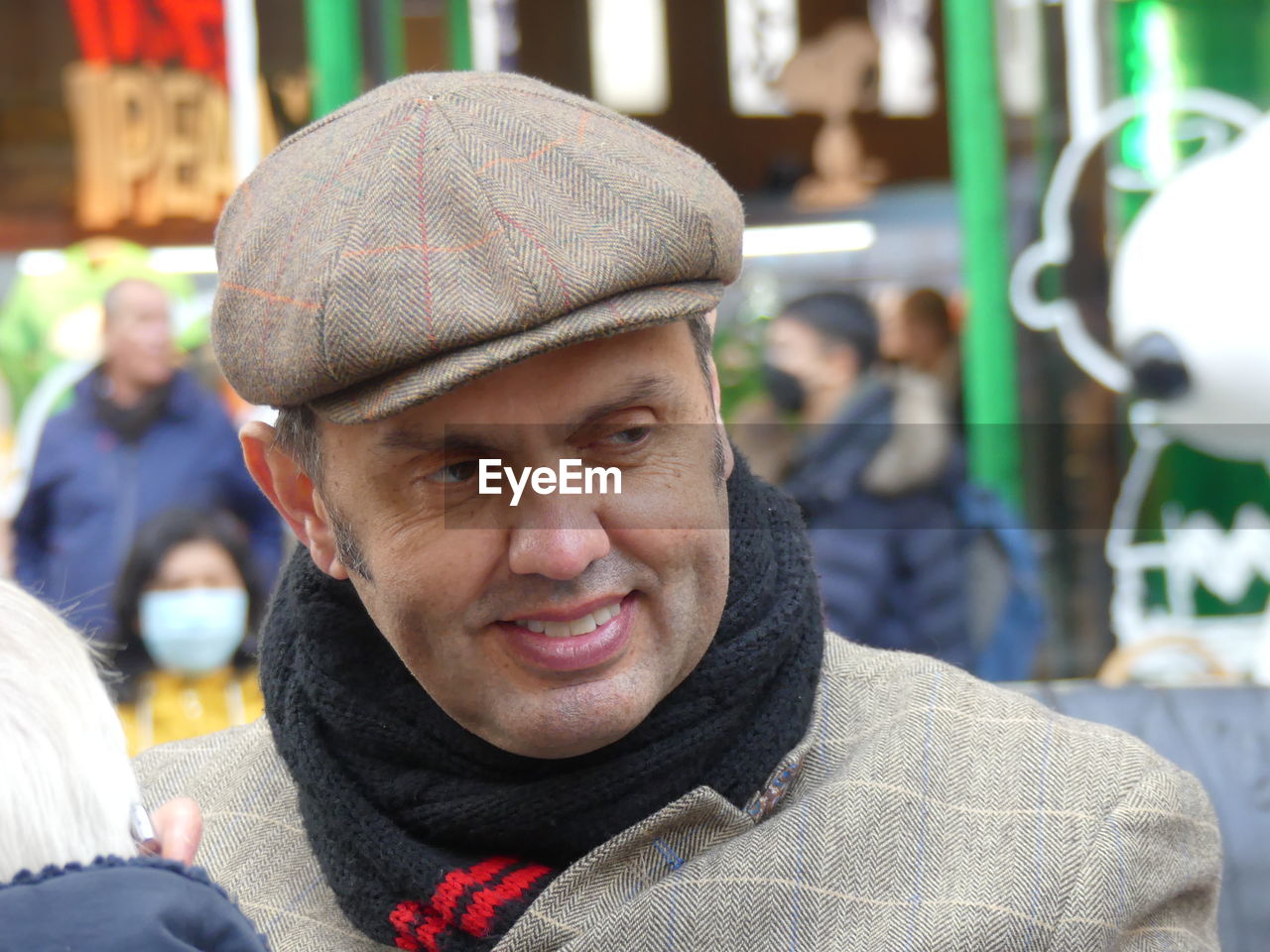 PORTRAIT OF SMILING MAN WITH HAT