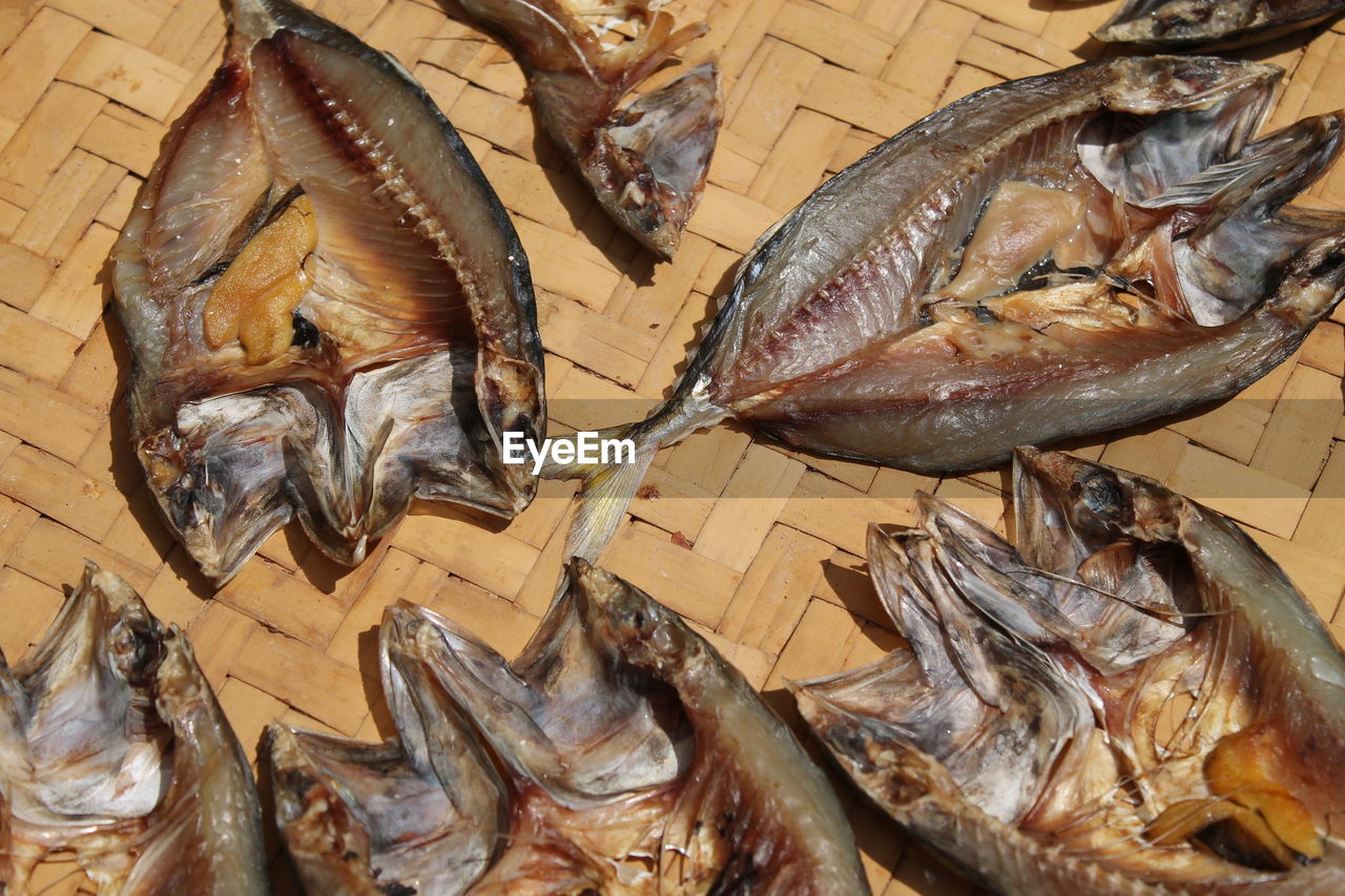 High angle view of dried fish on wicker plate