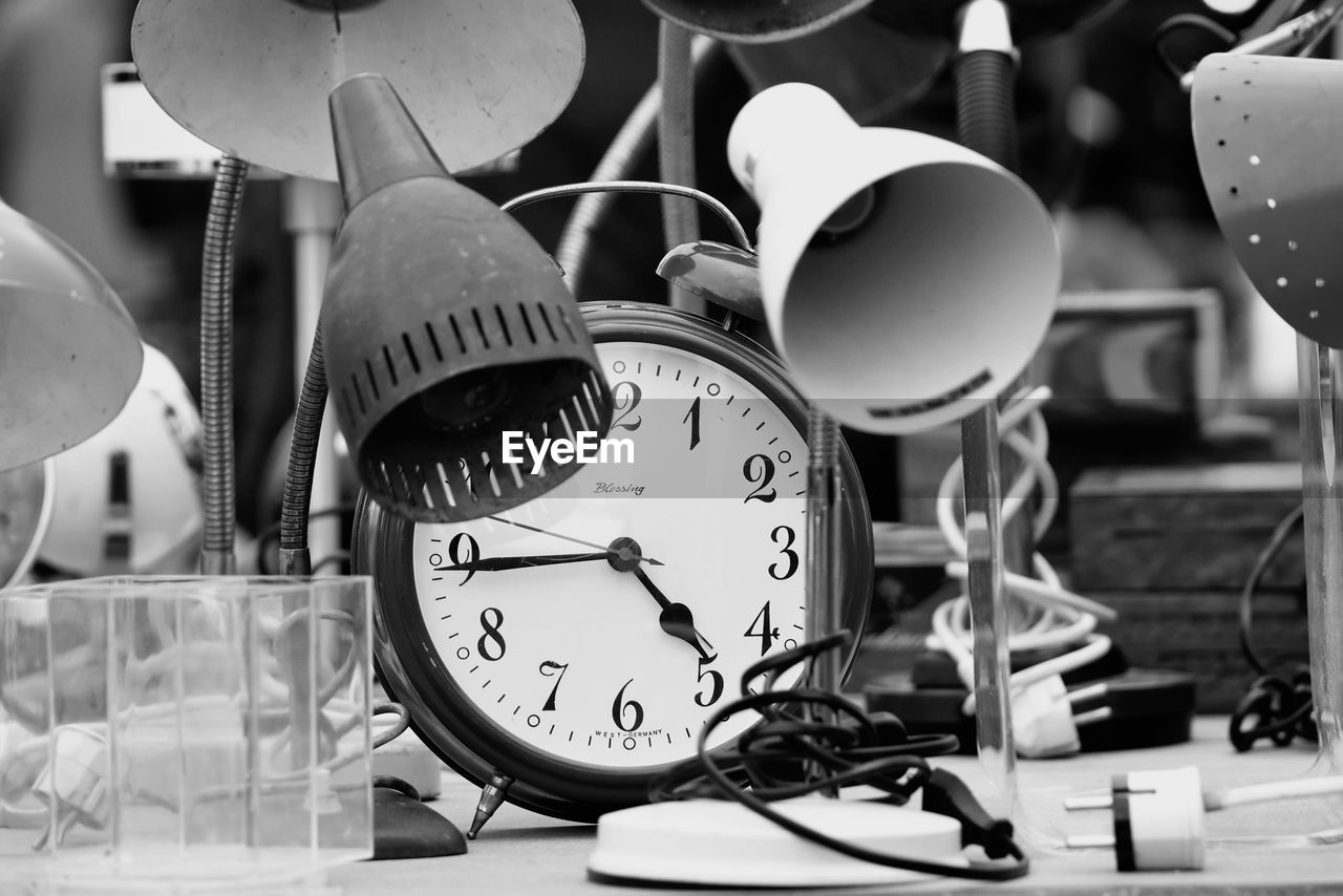 black and white, white, black, monochrome, monochrome photography, clock, time, alarm clock, indoors, no people, drums, table, still life photography, close-up, still life