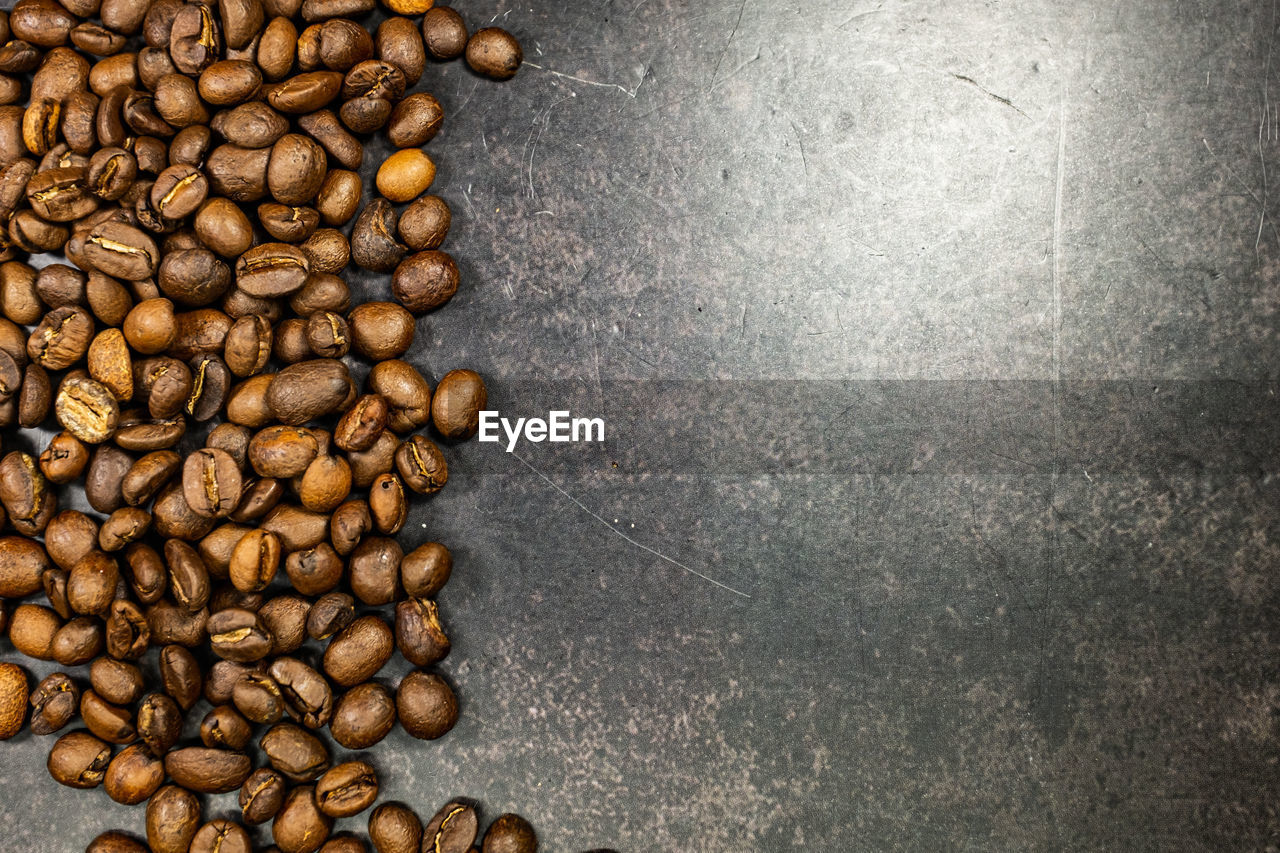 HIGH ANGLE VIEW OF ROASTED COFFEE BEANS