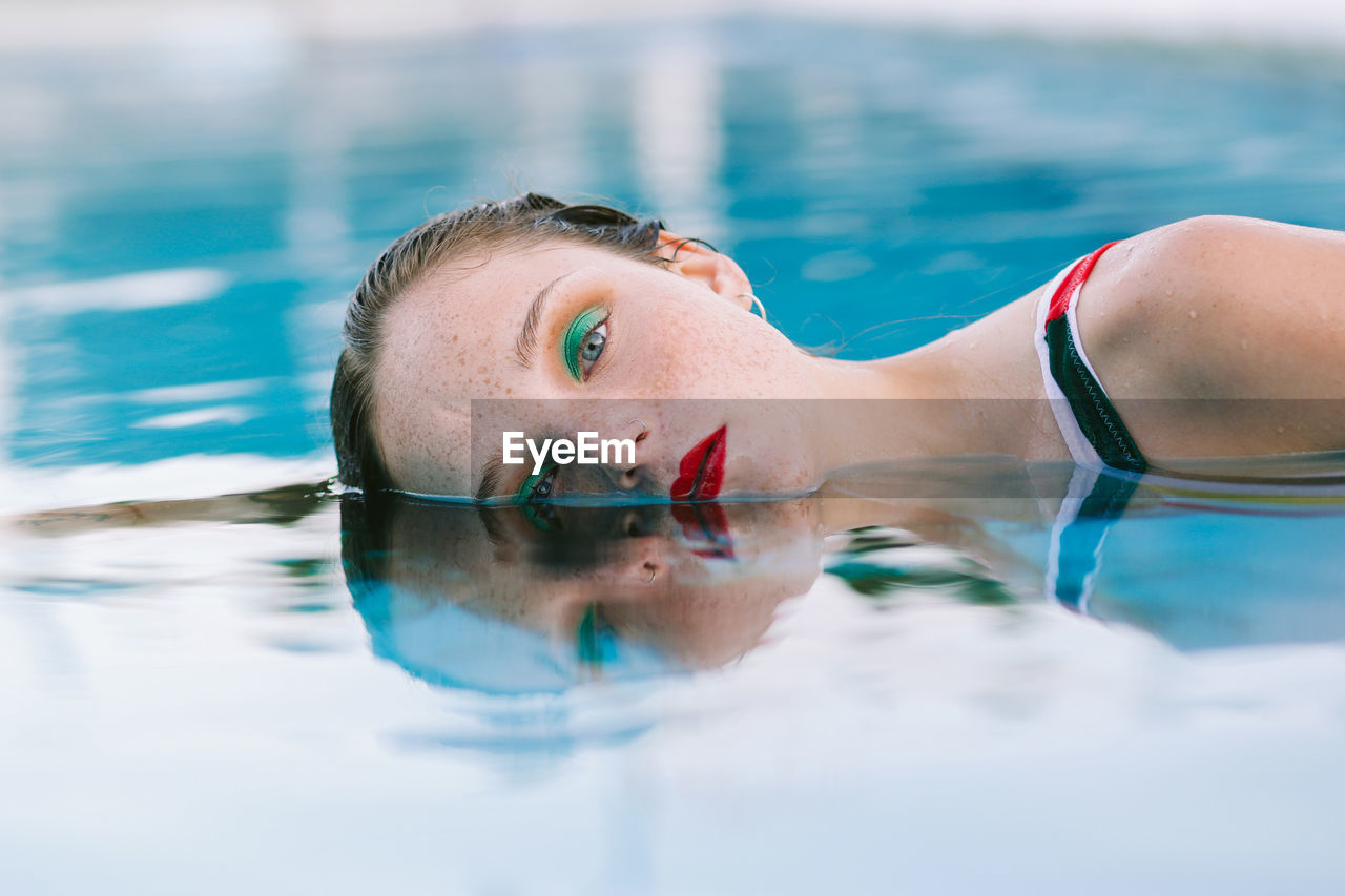 Teen girl having fun in the swimming pool