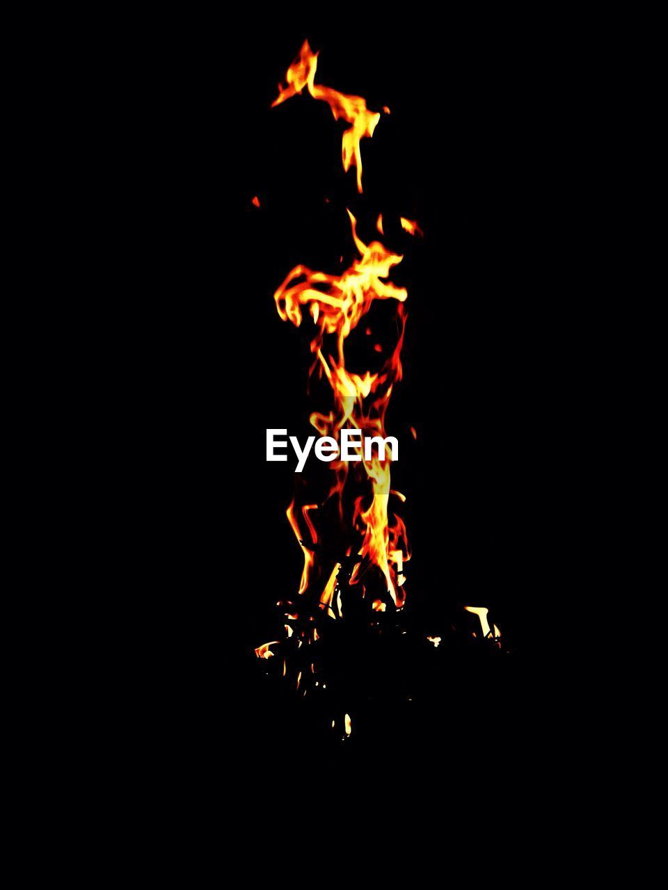 VIEW OF FIRE IN DARK ROOM