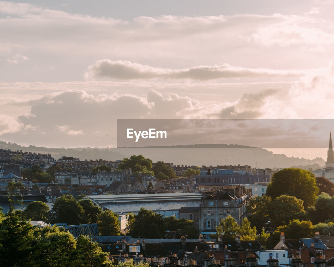 High angle view of city by river against sky