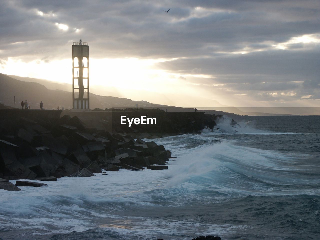 SCENIC VIEW OF SEA AT SUNSET