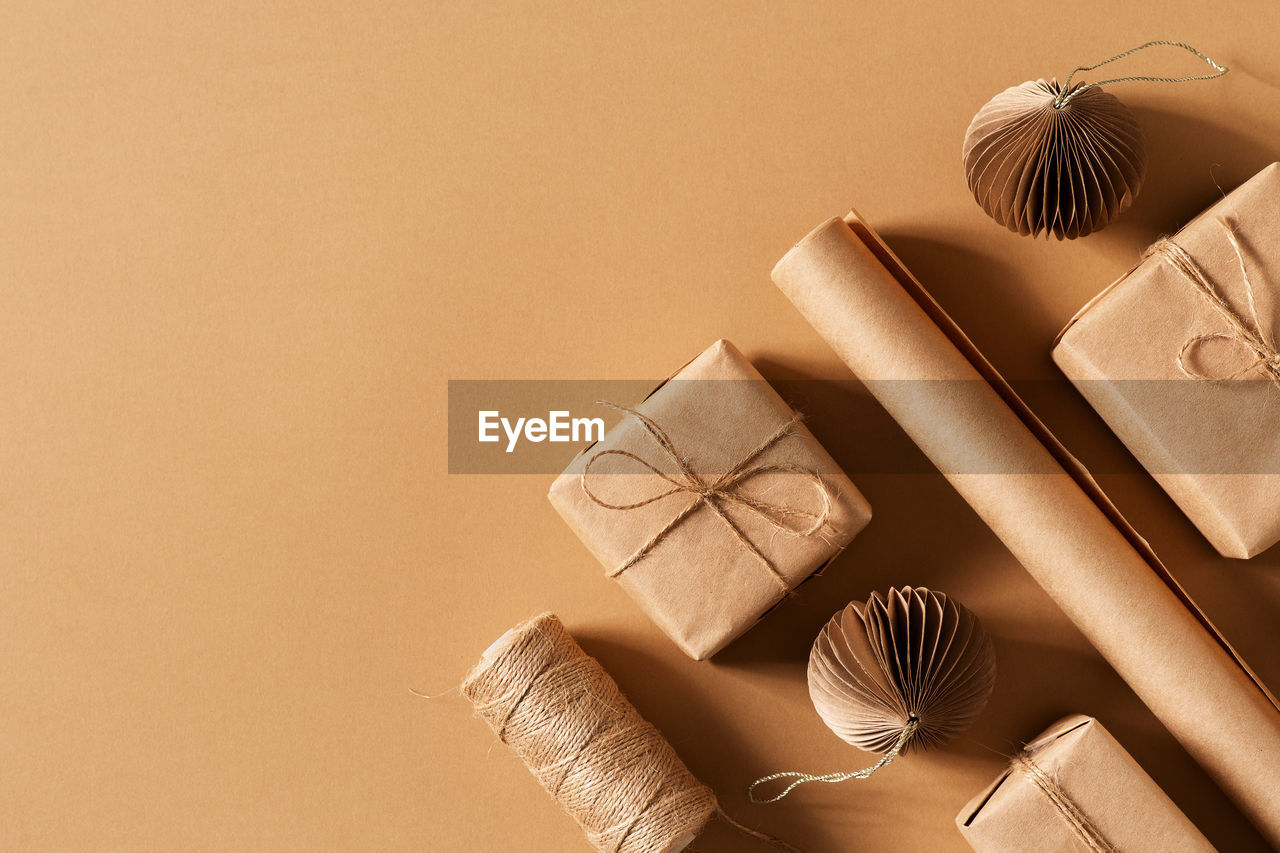 HIGH ANGLE VIEW OF BOX ON TABLE AGAINST WALL