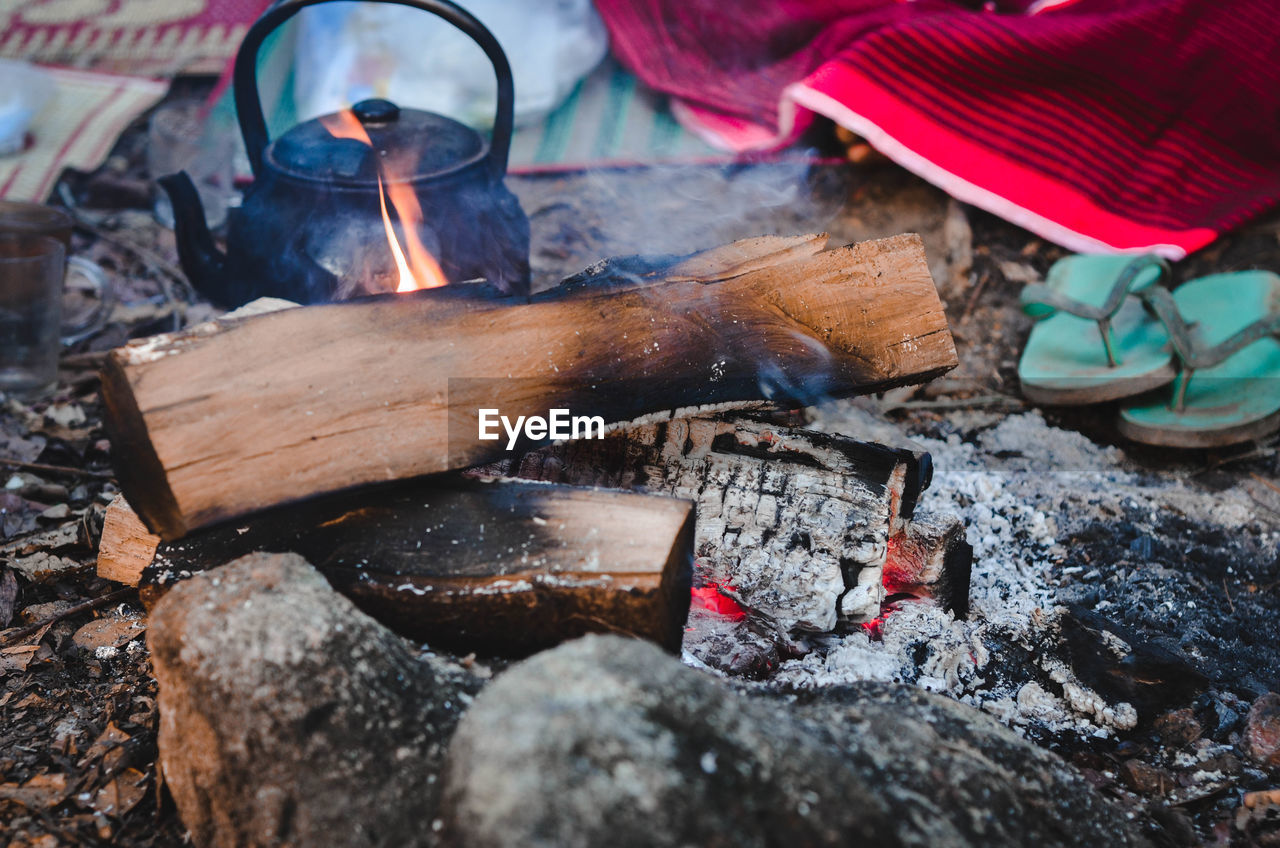 HIGH ANGLE VIEW OF FIRE ON LOG