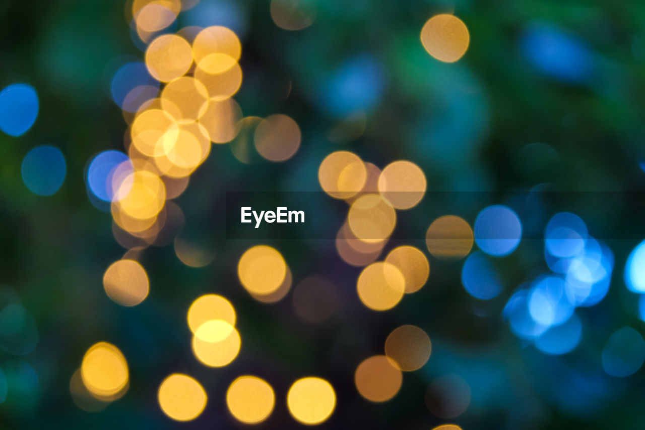 defocused, illuminated, decoration, night, celebration, circle, lighting equipment, shape, holiday, no people, abstract, christmas, geometric shape, backgrounds, light - natural phenomenon, christmas lights, vibrant color, glowing, light, pattern, christmas decoration, tree, yellow, spotted, street light, macro photography, multi colored, shiny, light bulb, nature, green, religion, blue, flower, spirituality, ethereal, light effect, saturated color, christmas tree, lens flare, outdoors, sphere, event, electric light, textured effect, street, belief, funky, motion, disco lights, tranquility, group, blurred motion, brightly lit, disco ball, tradition, petal, group of objects, city