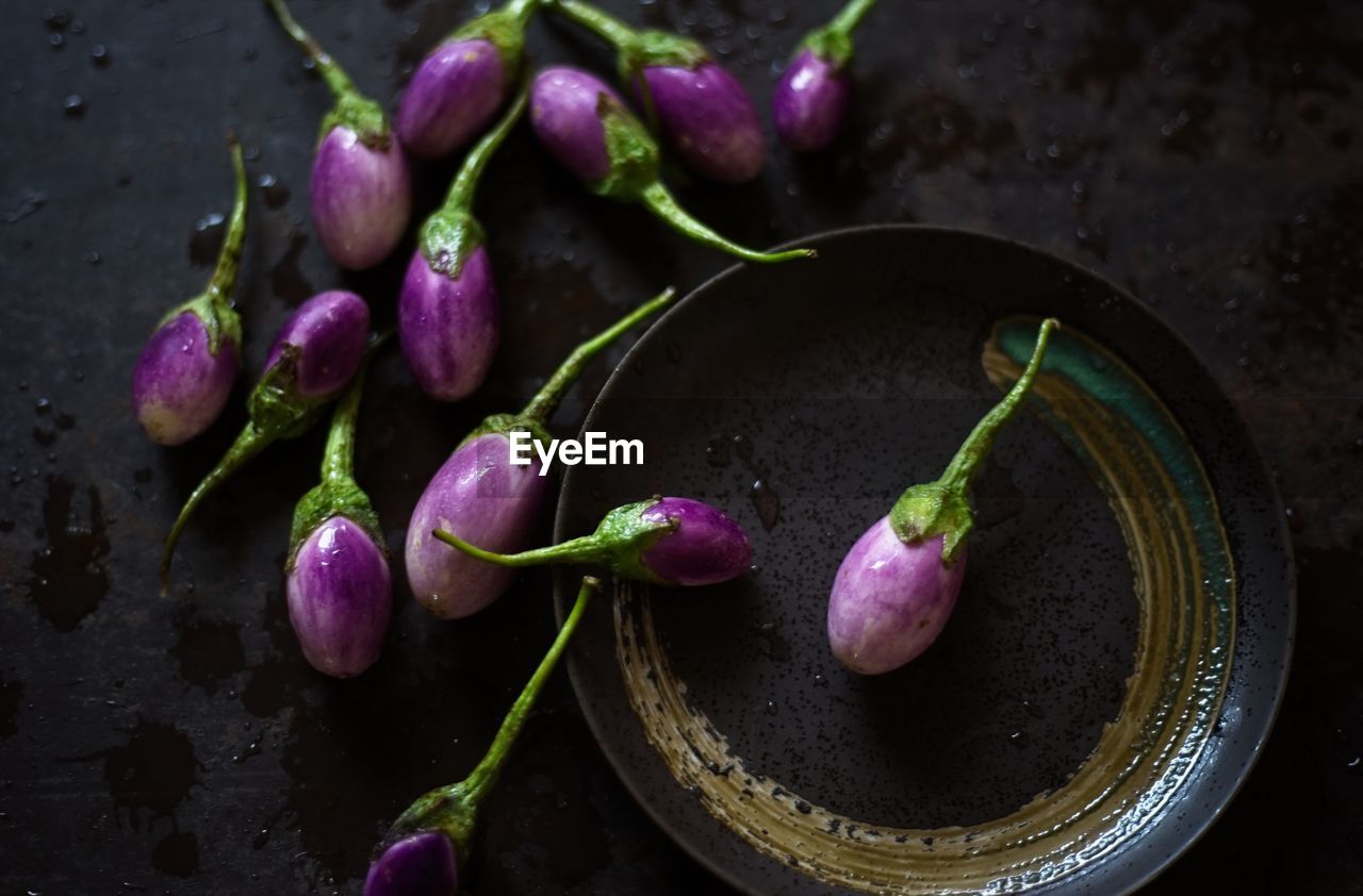 High angle view of eggplants in plate on table