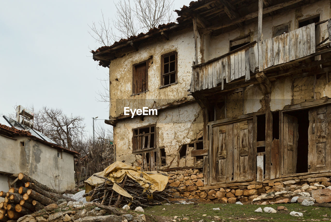 LOW ANGLE VIEW OF ABANDONED BUILDING