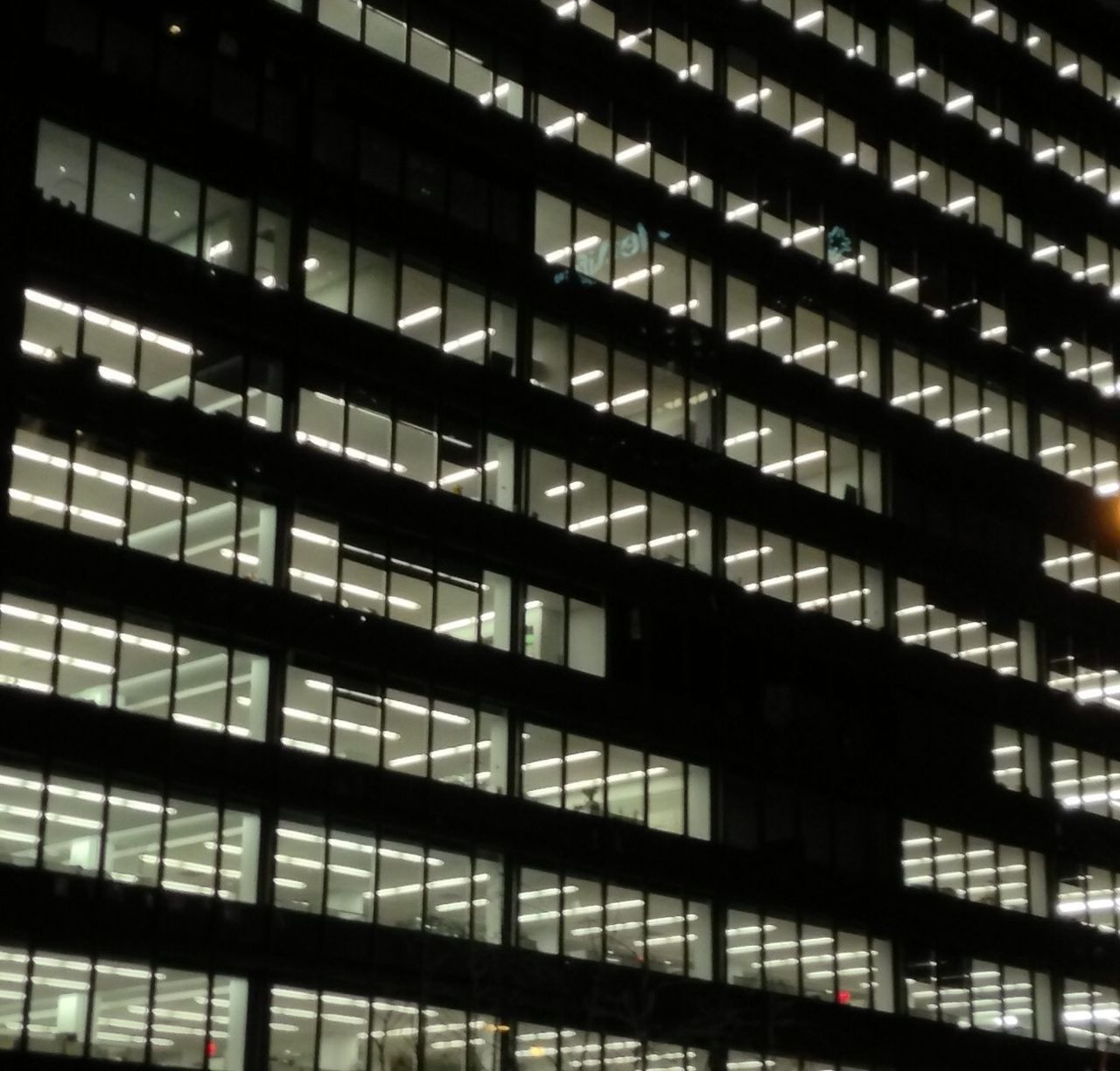 LOW ANGLE VIEW OF ILLUMINATED BUILDING