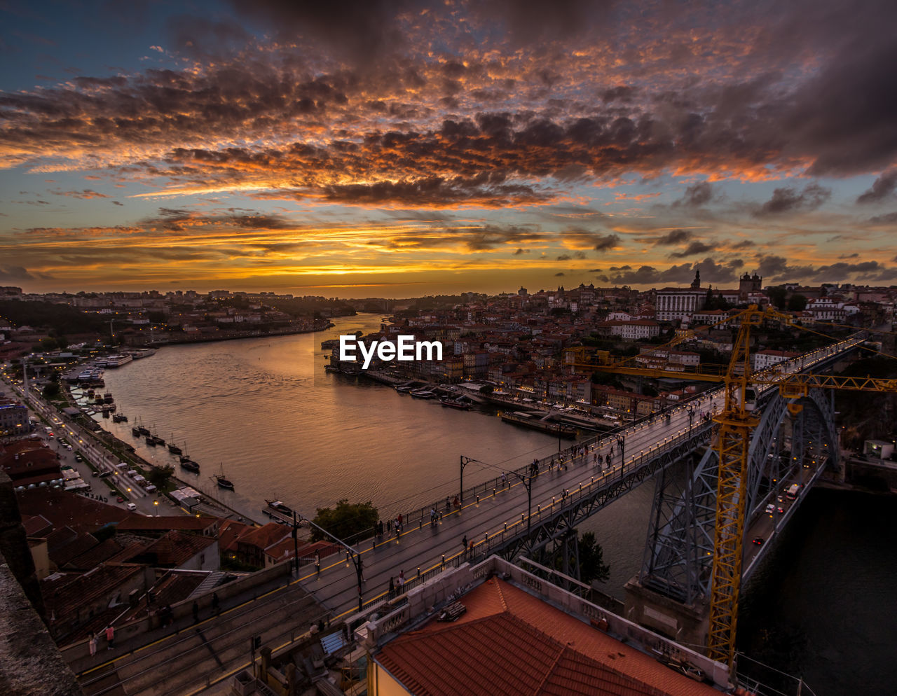 High angle view of bridge over river against sky at sunset