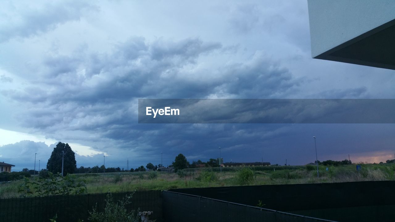 VIEW OF ROAD AGAINST CLOUDY SKY