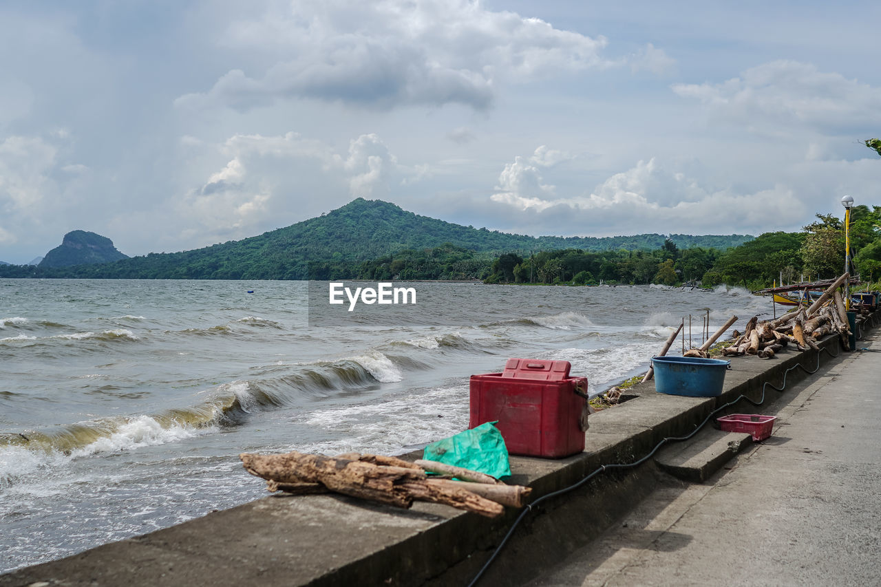 water, shore, sea, beach, sky, coast, land, nature, cloud, transportation, body of water, scenics - nature, bay, mountain, beauty in nature, nautical vessel, day, vacation, ocean, mode of transportation, no people, vehicle, travel destinations, travel, tranquility, outdoors, boat, sand, environment, coastline, tranquil scene, landscape, non-urban scene, pier, tourism, moored, tree