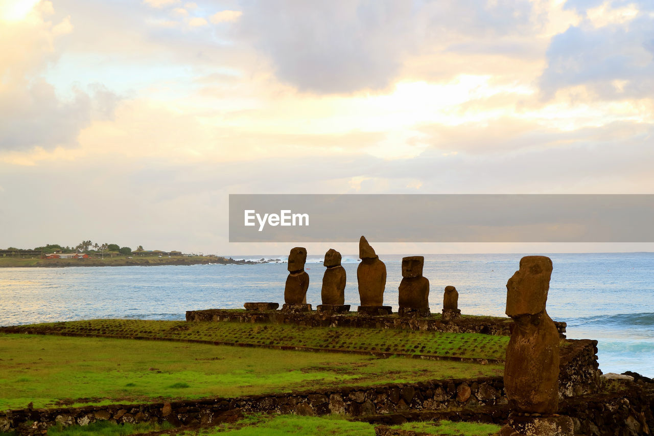 SCENIC VIEW OF ROCKS ON SHORE AGAINST SKY