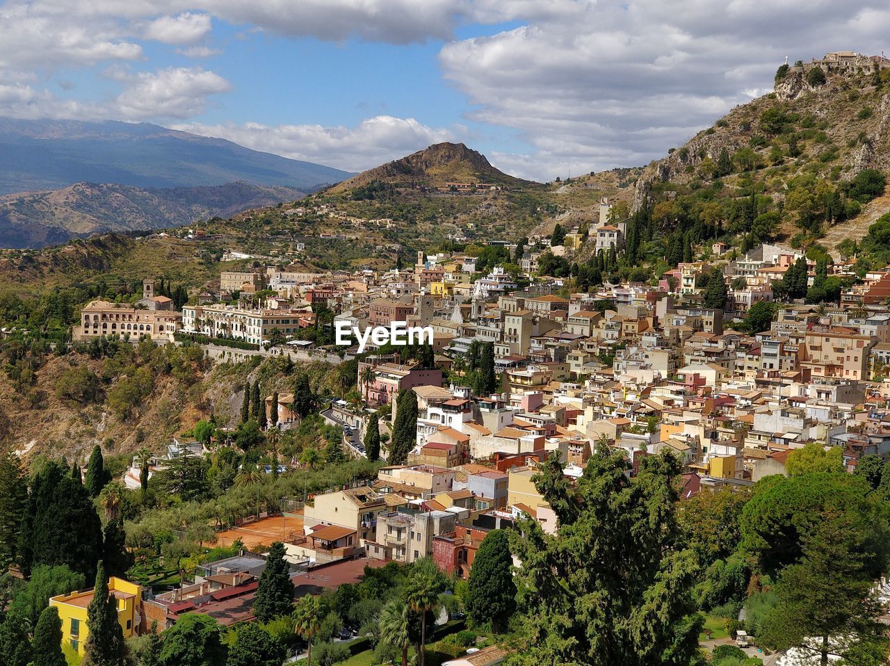 Aerial view of town against sky