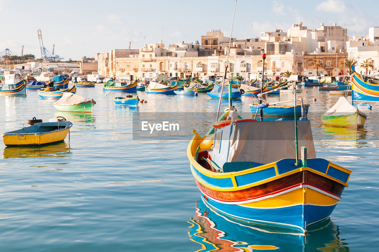 Colorful boats - mediterranean  fisherman village in the south east of malta. marsaxlokk, malta.