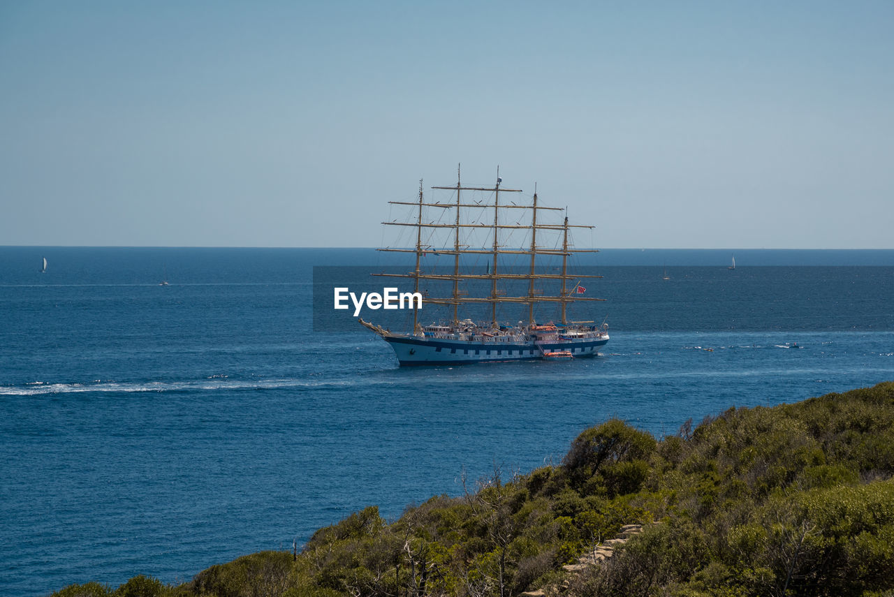 sea, water, ocean, transportation, nautical vessel, sky, coast, mode of transportation, horizon over water, vehicle, nature, ship, horizon, bay, sailboat, no people, shore, sailing, scenics - nature, tower, travel, beauty in nature, blue, watercraft, clear sky, day, boat, land, tall ship, outdoors, beach, sailing ship, architecture, tranquility, body of water, tranquil scene, travel destinations