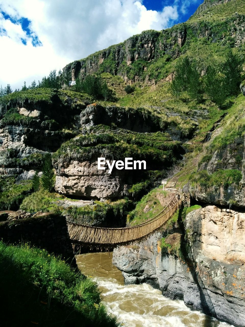 STREAM FLOWING THROUGH ROCKS