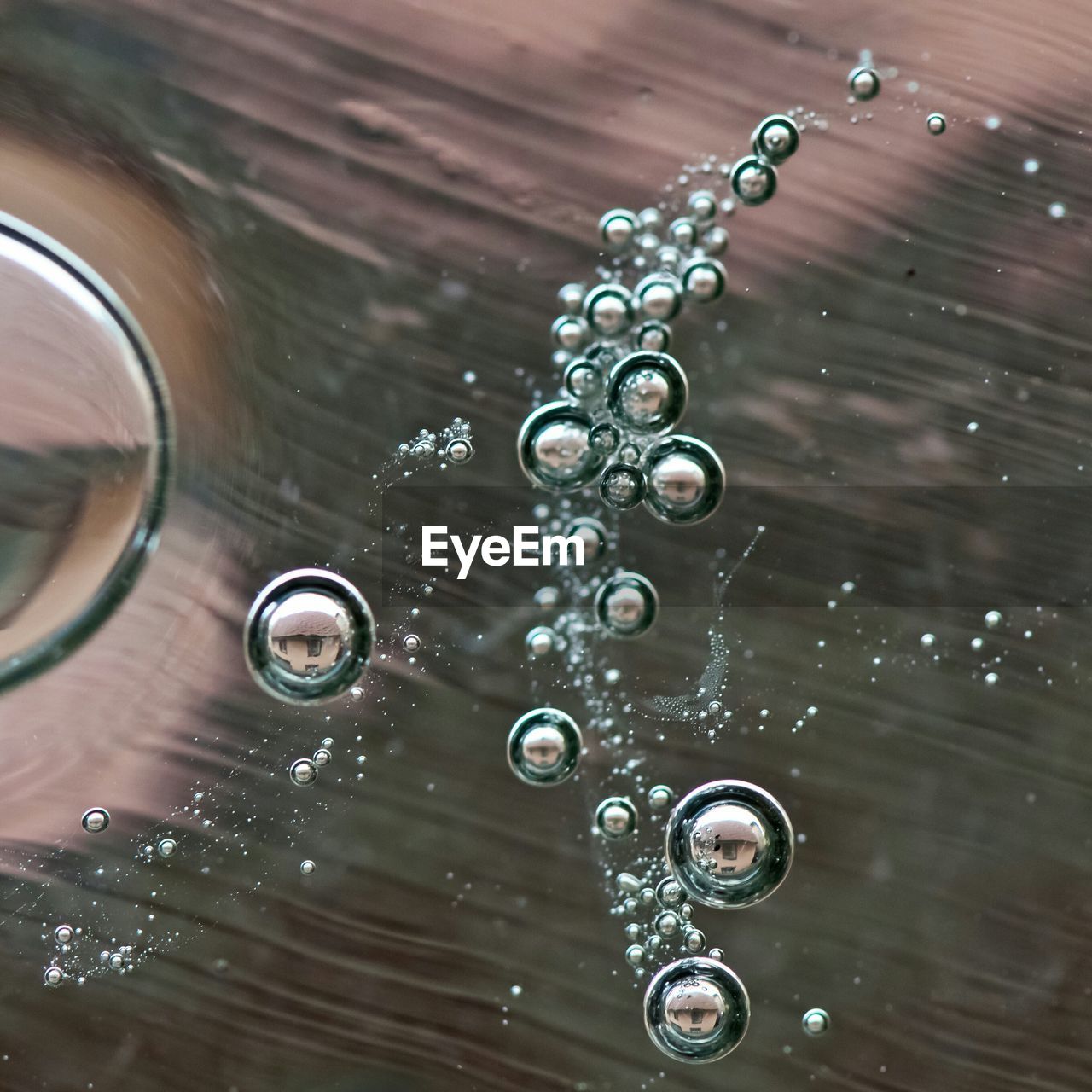 Close-up of bubbles in drinking glass