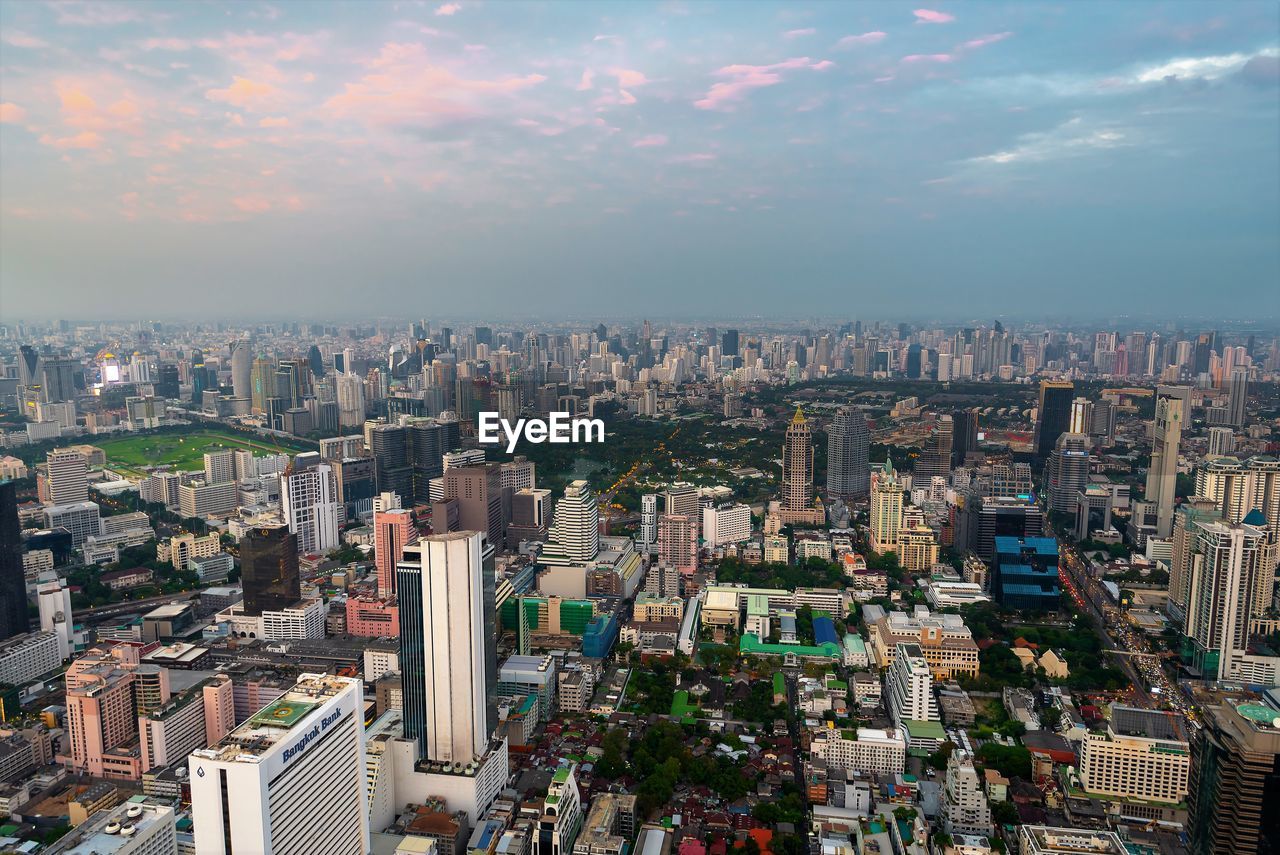 High angle view of modern buildings in city against sky