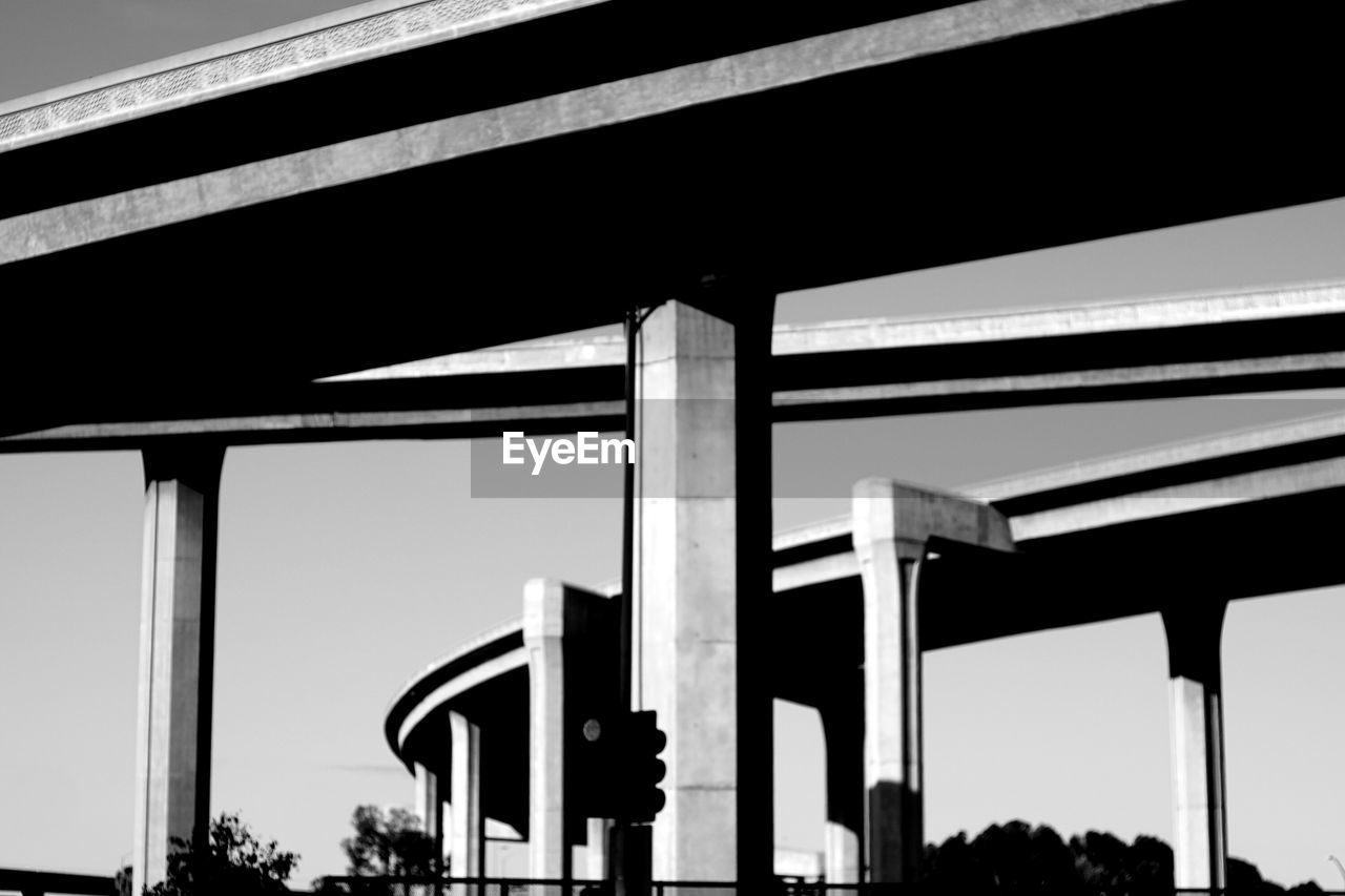 Low angle view of bridge in city