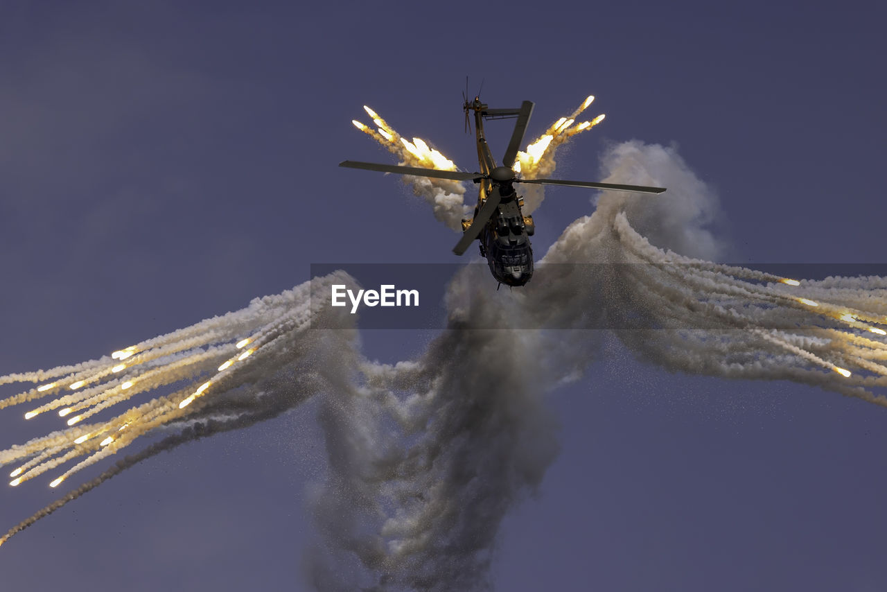 wing, macro photography, nature, sky, flying, insect, no people, animal, outdoors, blue, motion, air vehicle, vehicle, aircraft