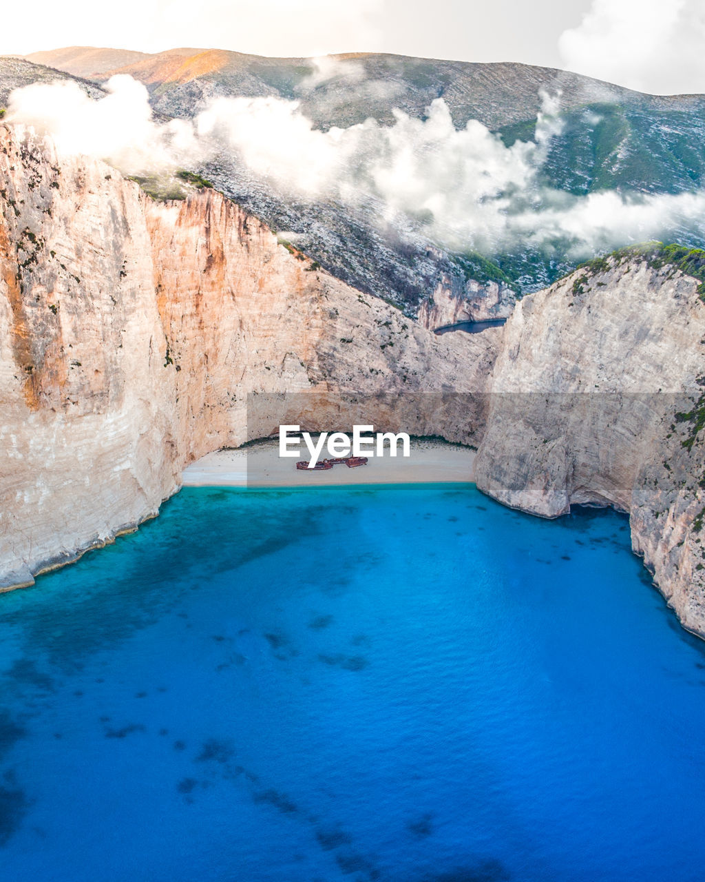 Scenic view of sea by rock formation