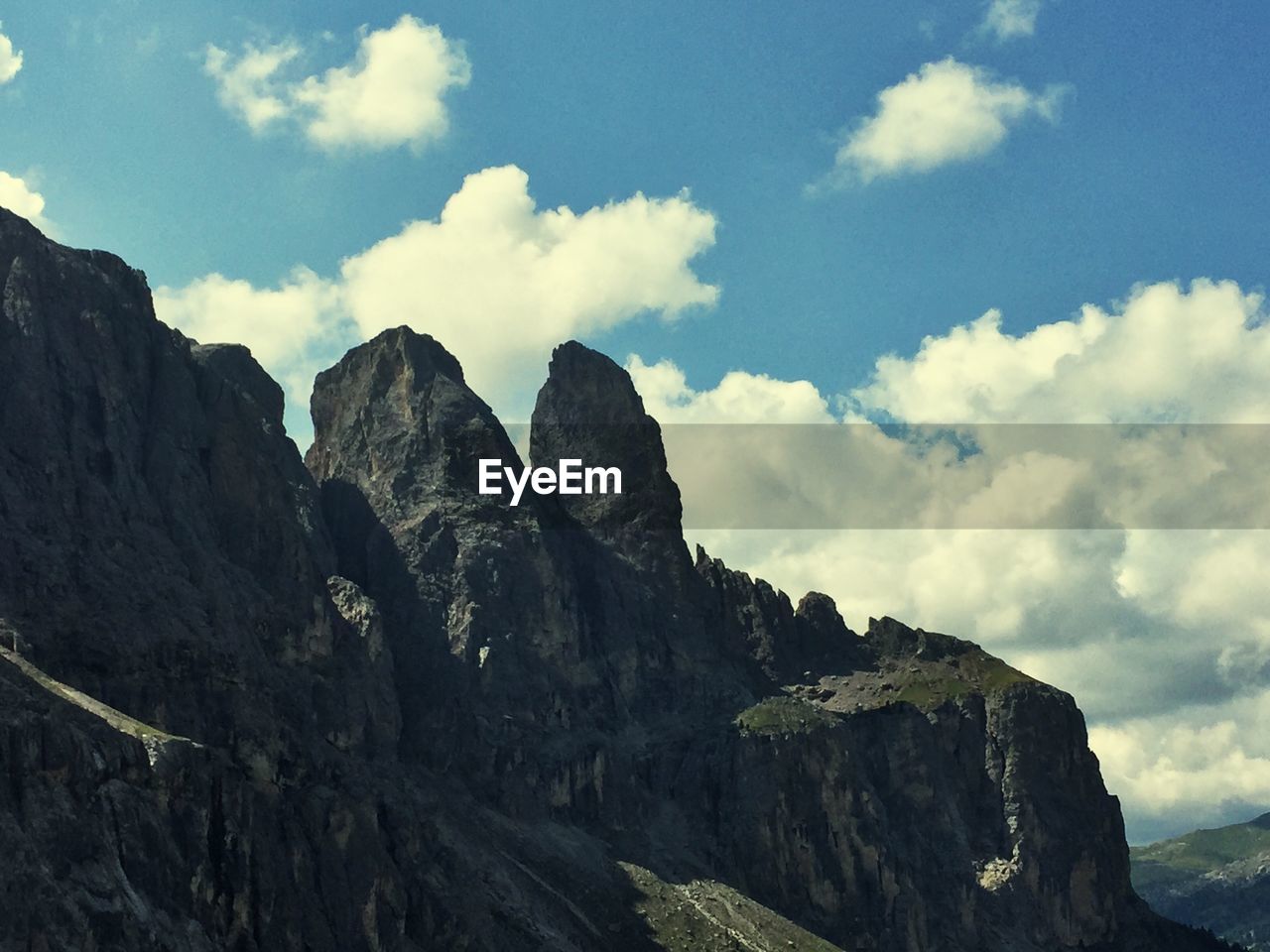 Low angle view of rock formations on landscape against sky