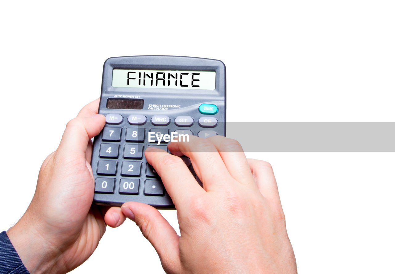 hand, technology, business, white background, finance, communication, cut out, keypad, calculator, number, wireless technology, adult, finger, business finance and industry, close-up, holding, indoors, studio shot, remote control, retail, office equipment, multimedia, corporate business, one person, control, finance and economy, buying