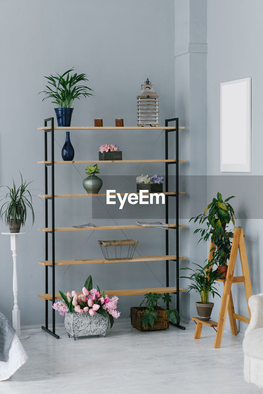 Shelving with a variety of decor in the living room or in the workshop at home