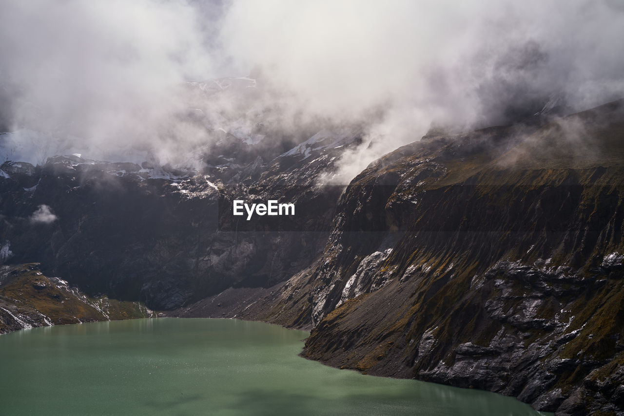 Scenic view of mountain lake against sky