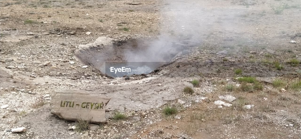 soil, geology, nature, no people, day, smoke, communication, high angle view, land, heat, sign, outdoors, environment, text, steam