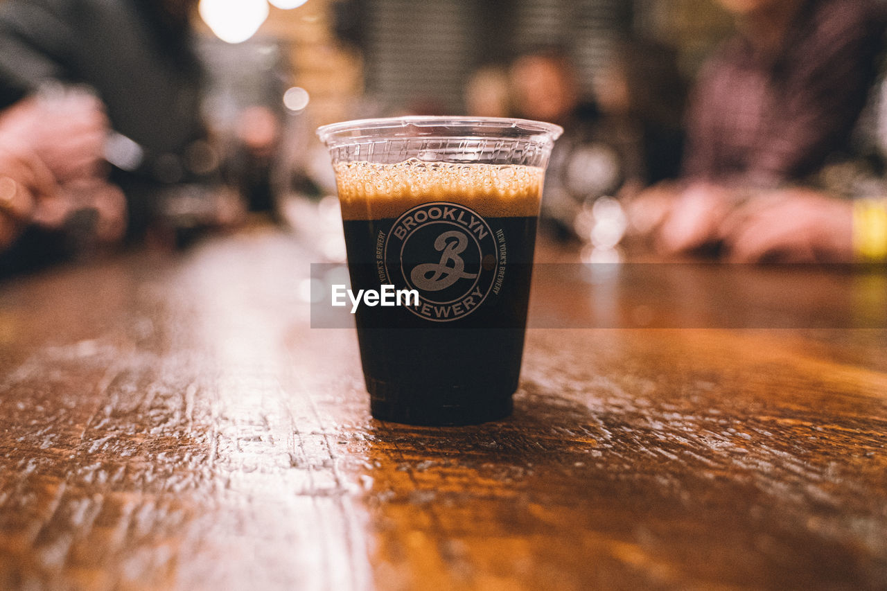 CLOSE-UP OF DRINK ON TABLE