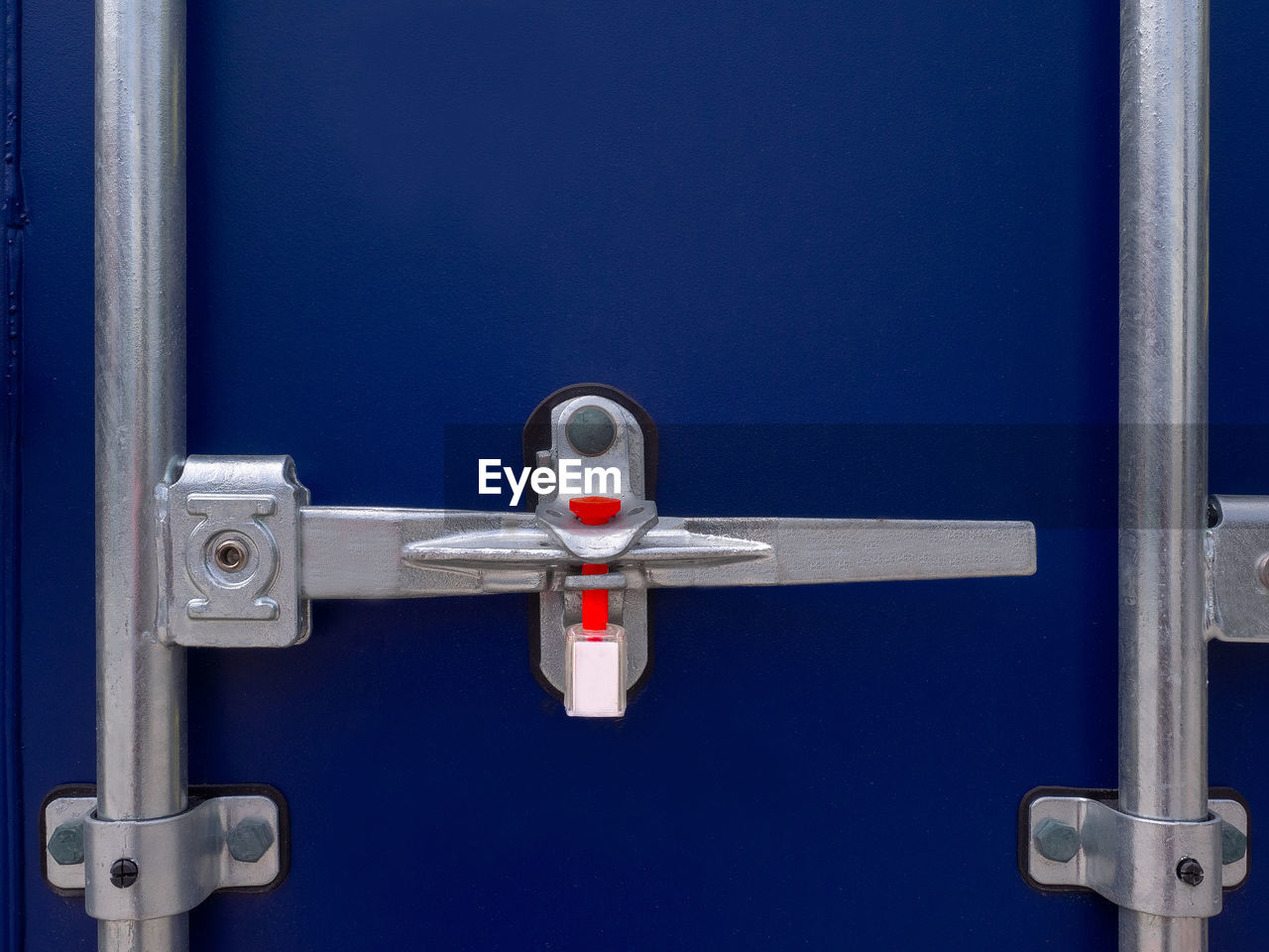 CLOSE-UP OF CLOSED DOOR AGAINST BLUE SKY AND LIGHT