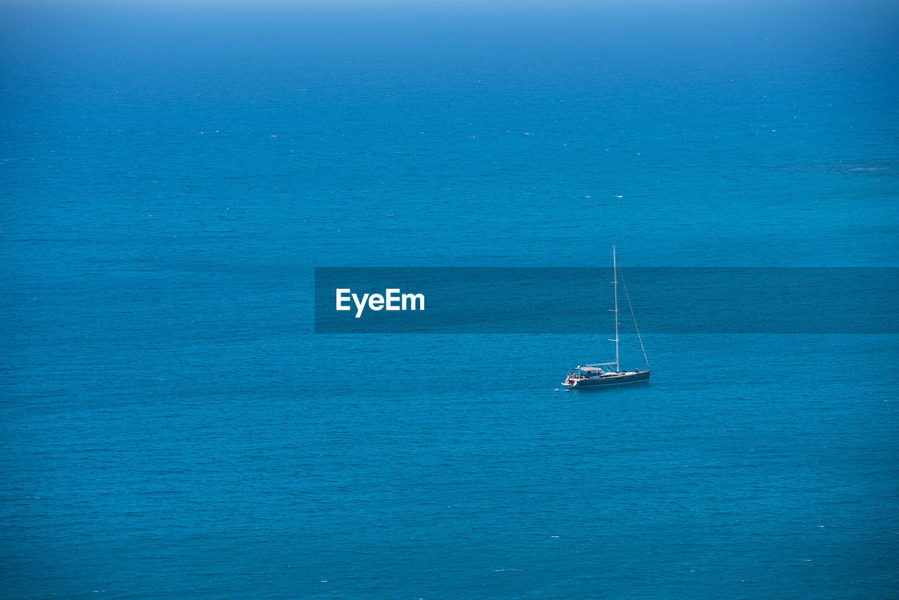 Alone yacht sailing in open sea. freedom, travel concept