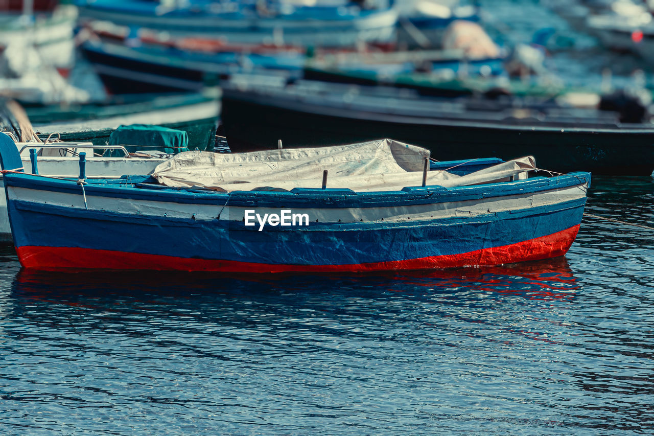 Fishing boats moored in sea