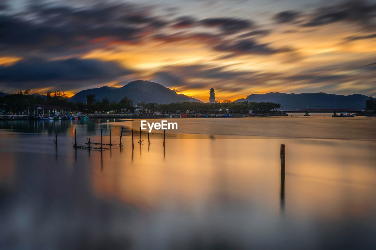 Scenic view of sea against orange sky