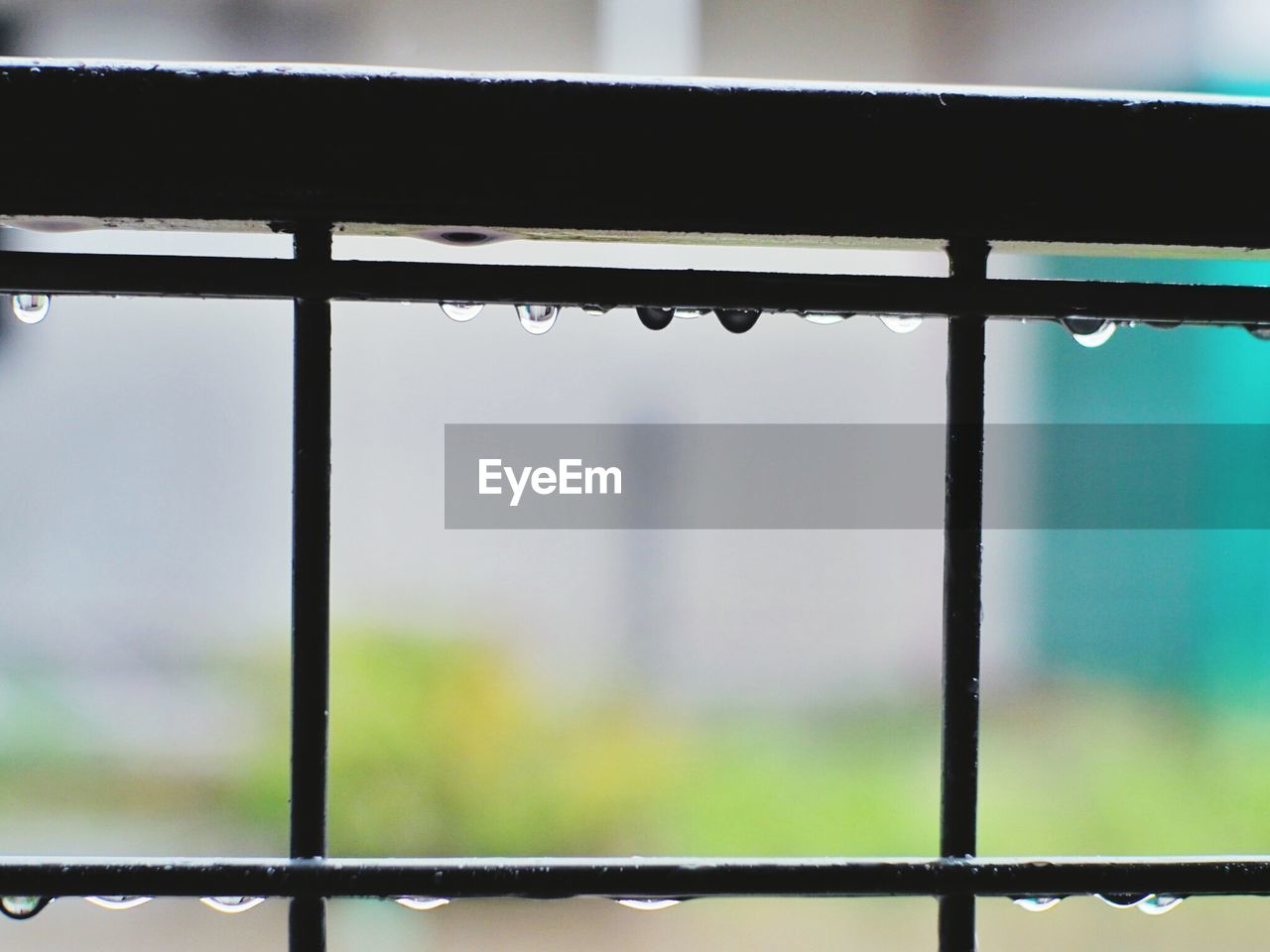 CLOSE-UP OF WET WINDOW AGAINST RAINY SEASON