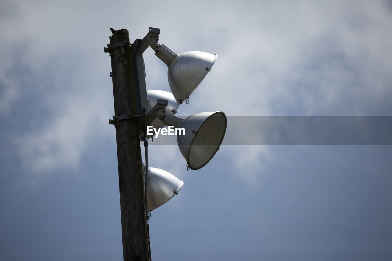 Close up of field lights in partially cloudy weather