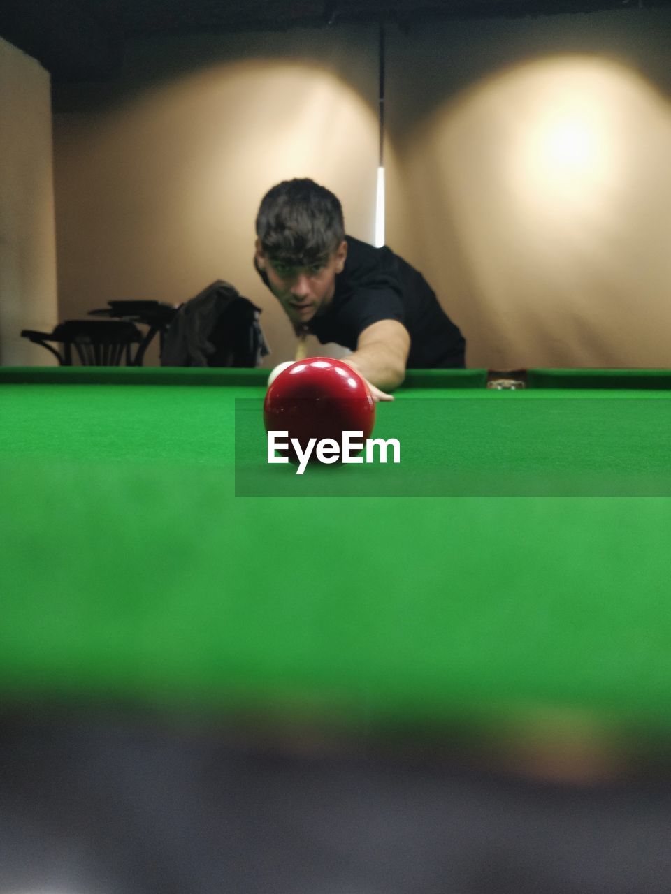 billiards, sports, ball, pool ball, pool table, pool sport, snooker, indoor games and sports, game, leisure activity, table, adult, billiard room, billiard table, pool cue, green, one person, billiard ball, recreation, cue stick, indoors, men, concentration, relaxation, individual sports, aiming, sports equipment, pool hall, lifestyles, young adult, eight-ball, nine-ball, leisure games, sphere, skill, recreation room