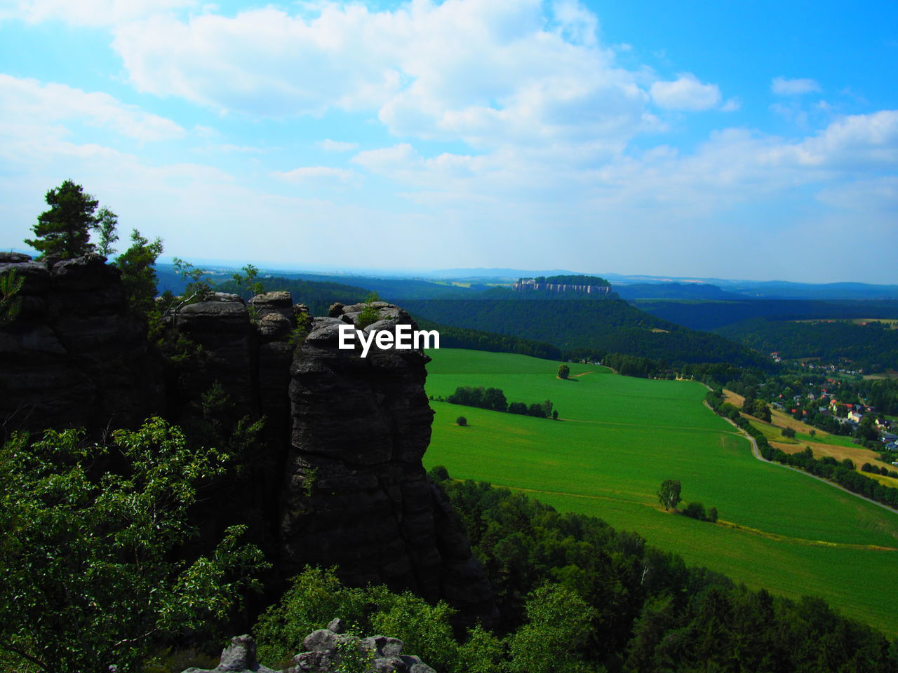 SCENIC VIEW OF LANDSCAPE AND MOUNTAINS AGAINST SKY