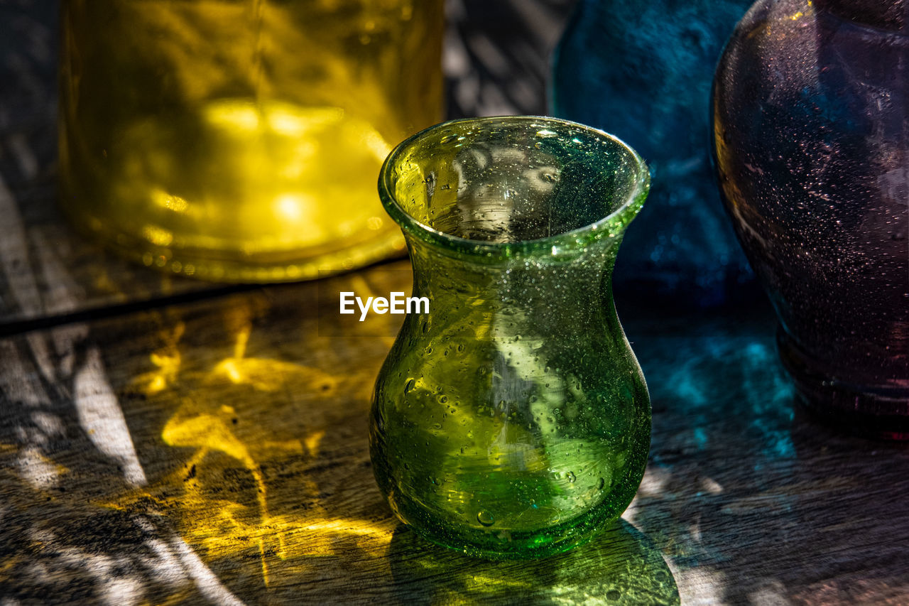 Close-up of glass container on table