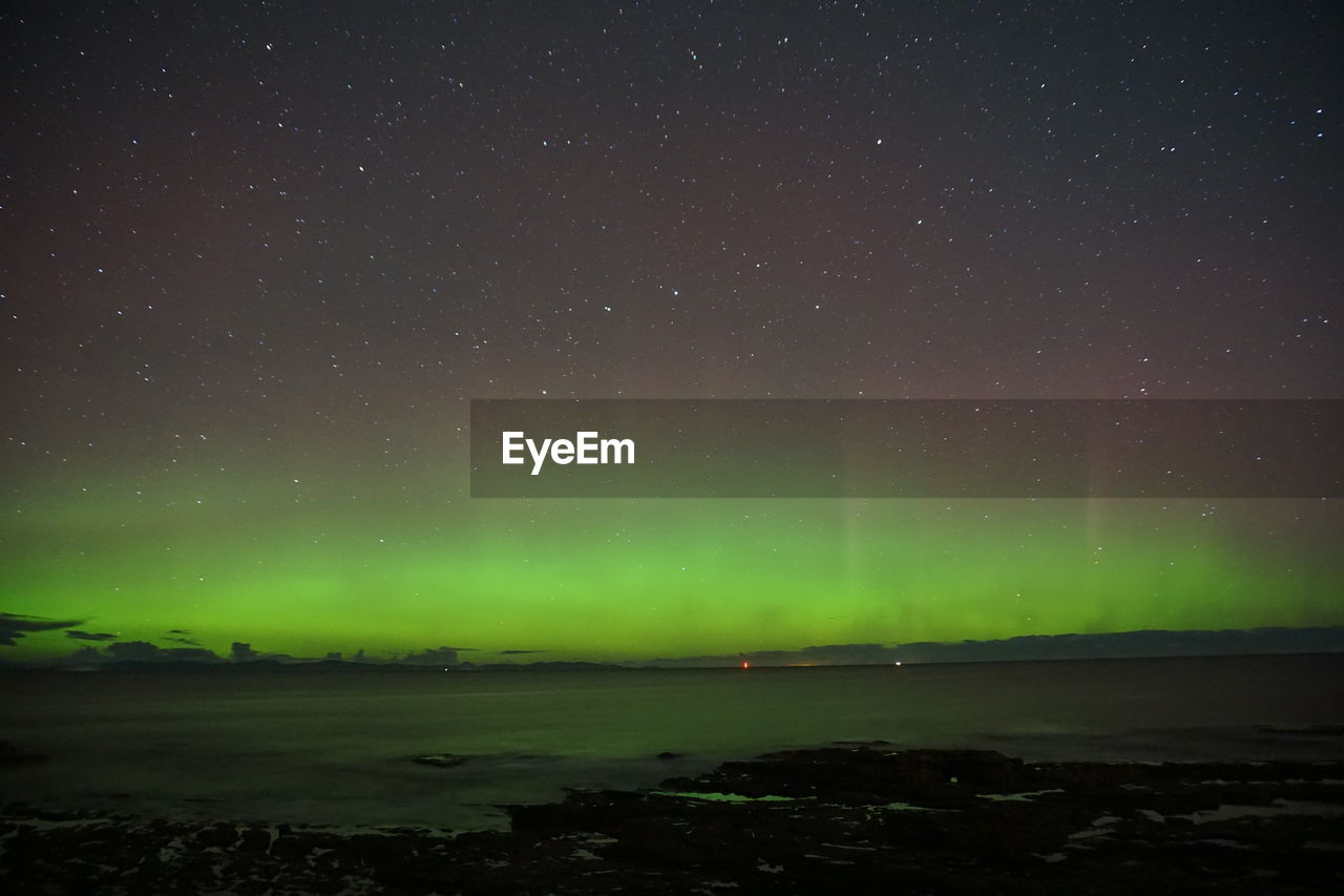 aurora, night, star, sky, space, beauty in nature, astronomy, scenics - nature, environment, green, nature, landscape, aurora polaris, tranquility, no people, dramatic sky, tranquil scene, illuminated, natural phenomenon, land, science, light - natural phenomenon, idyllic, cold temperature, awe, outdoors, space and astronomy, winter, non-urban scene, glowing, mountain, mystery, snow, atmospheric mood