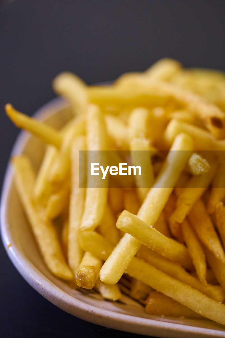 High angle view of french fries in plate on table